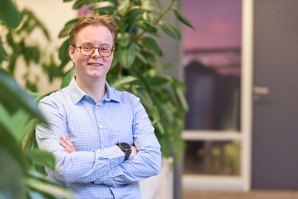 Young man standing in an office