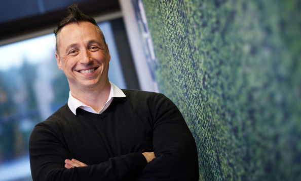 man leaning against a wall